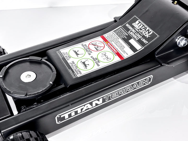 Close-up of a Titan terrain slim jack warning sticker