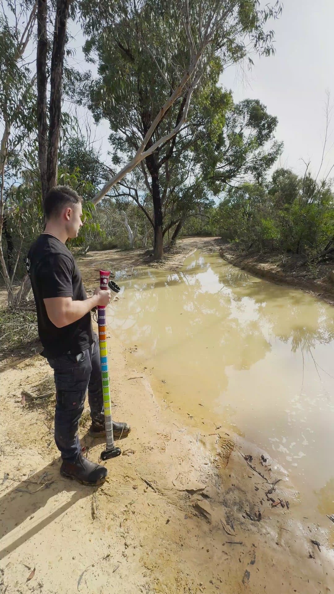 Depth gauge demonstration on muddy body of water