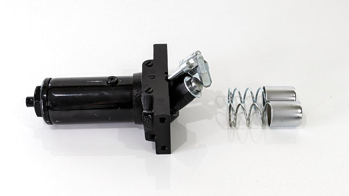 A black replacement pump for the Titan Terrain rugged Jack, featuring metal springs and hardware for installation